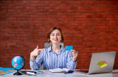 front-view-travel-agent-her-working-place-map-indoors-manager-operator-agency-world-document-occupation-worker